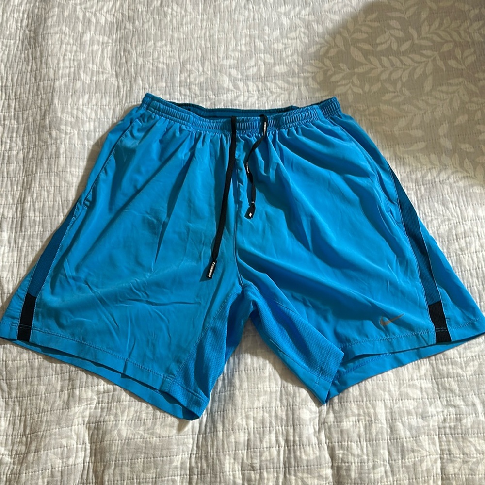 Nike men’s size medium running shorts. Liner, side pockets, rear zipper pocket